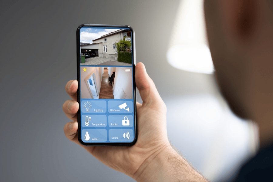 a close up shot of a mobile security footage feed of inside and outside of a home